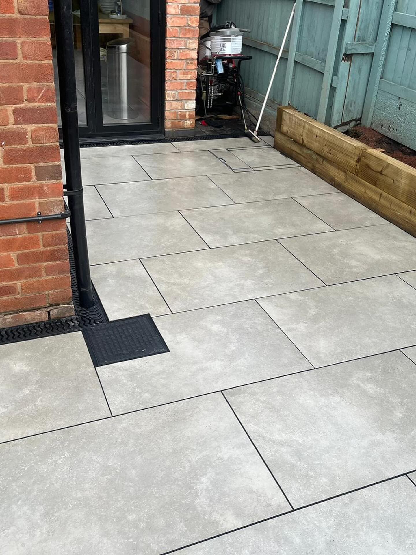After - Beautiful porcelain patio by Creative Contractors