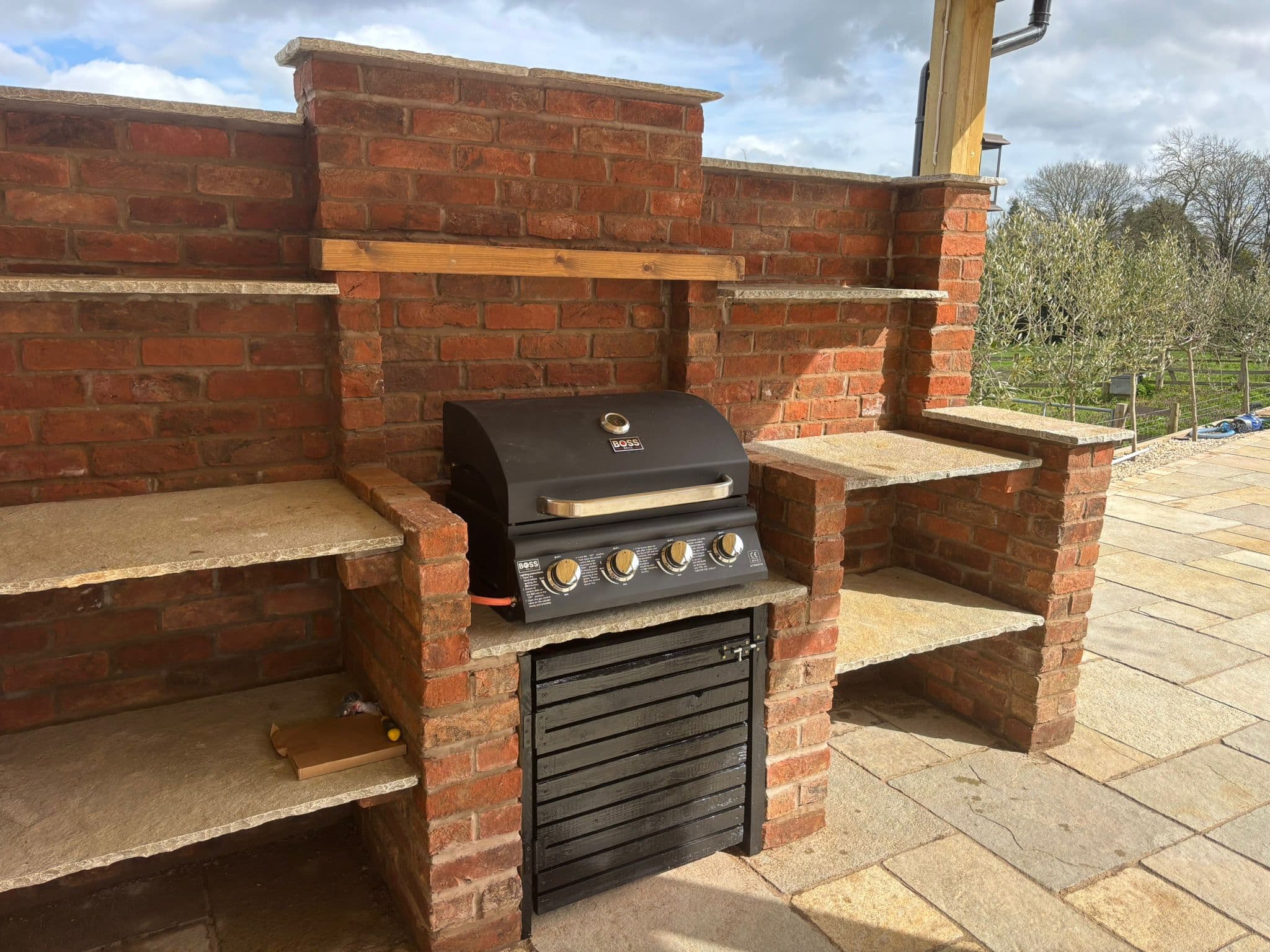 Brick BBQ kitchen with stone worktops